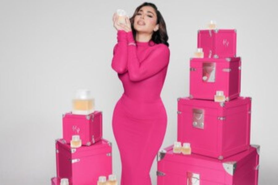 Huda Kattan posing with new product